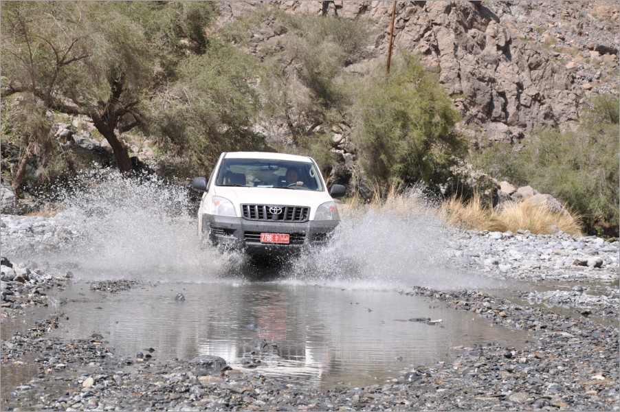 next trip through wadi bani awf - there was a hell of a lot of water and i was the driver...
